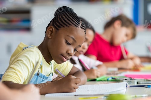 Preview: School girl writing in class