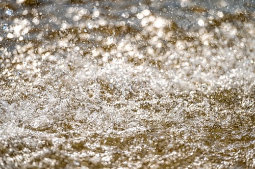 Preview: Water splash with small drops in the fountain. Abstract natural, selective focus, copy space