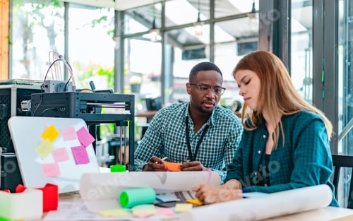 Preview: Diverse Startup Team Working on 3D Printing Project