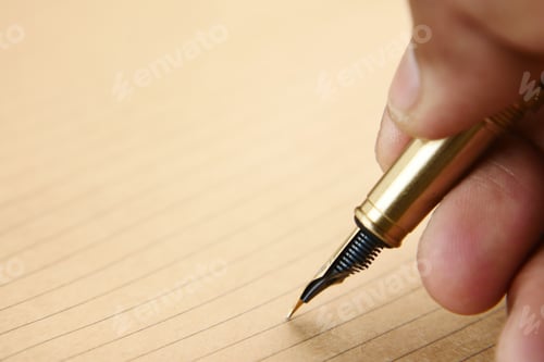 Preview: man's hand writing with a fountain pen on paper