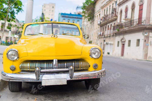Preview: View of yellow classic vintage car in Old Havana, Cuba