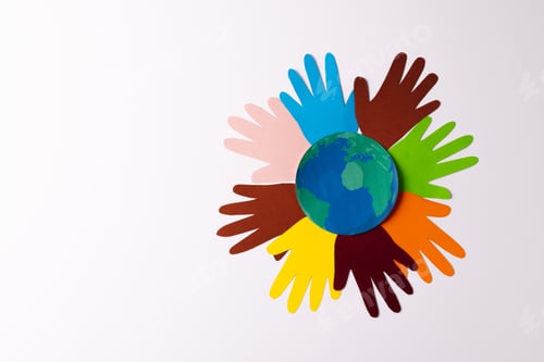 Preview: Paper cut out of multi coloured hands and globe with copy space on white background