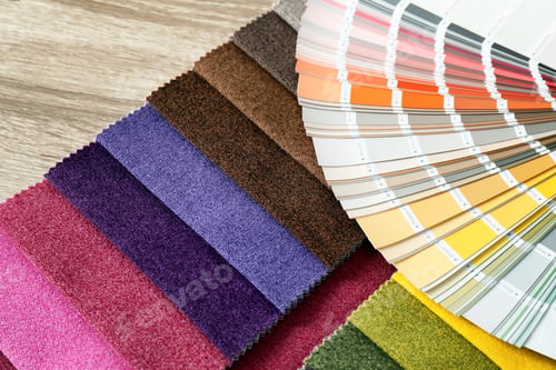 Preview: Upholstery fabric samples and color palette on table. Interior design