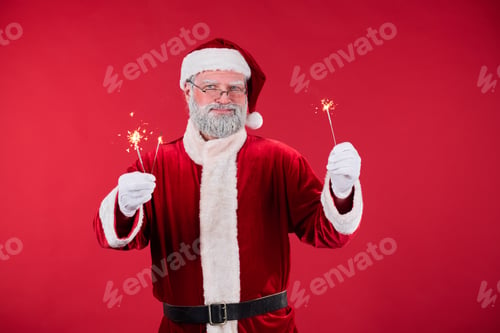 Preview: Santa Claus Holding Sparklers on Red Background