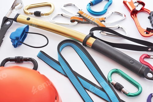 Preview: Climbing equipment for the safeness lying on the white table. Conception of extreme sports