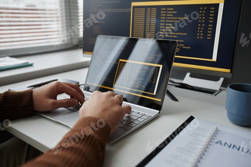Preview: Close Up of Male Hands Typing at Laptop Keyboard and Writing Code
