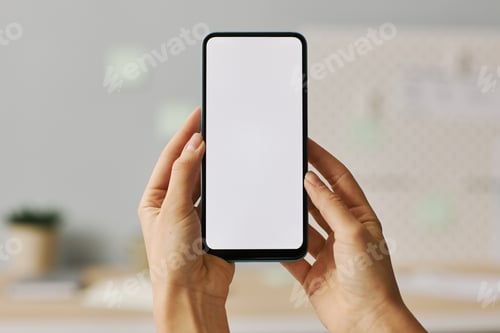 Preview: Female hands holding smartphone with white screen mock up