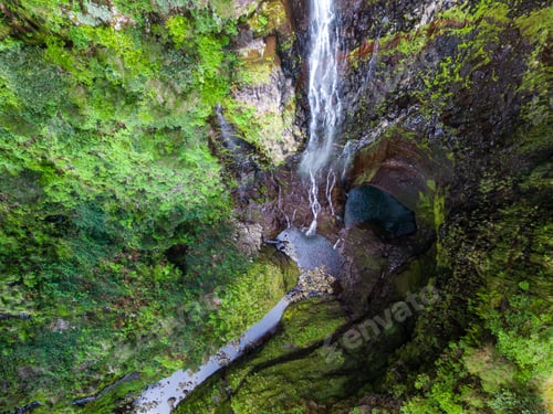 Preview: Aerial view of Levada 25 waterfalls surrounded by lush greenery. Madeira, Portugal