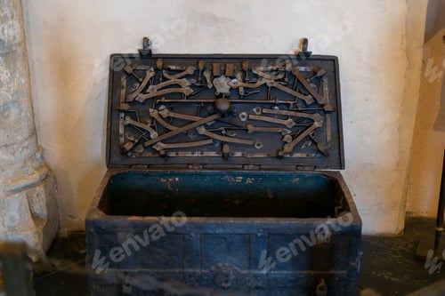 Preview: Antique chest with a complex lock in the castle on the floor.