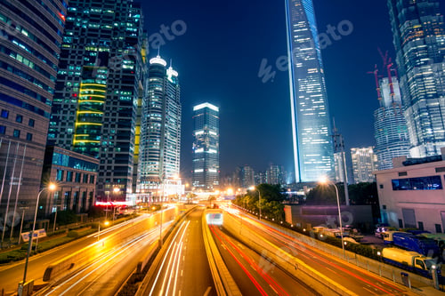 Preview: light trails on the street with modern building