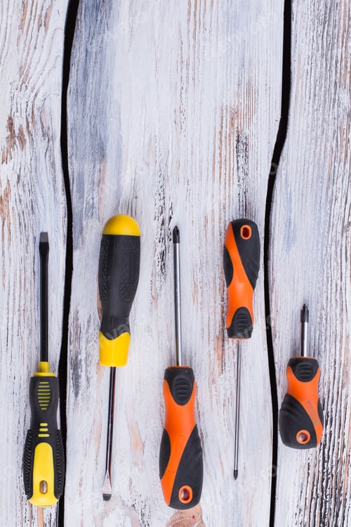 Preview: Set of screwdrivers on wooden background.