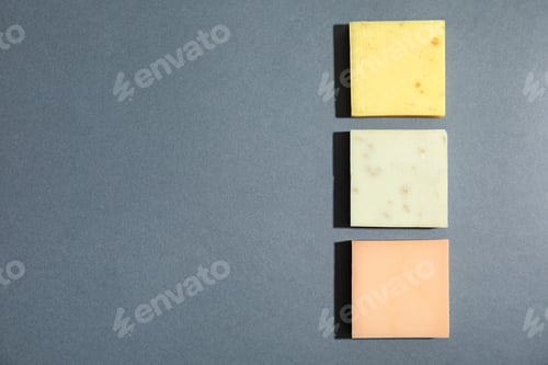 Preview: Hand made soap bars on grey background, top view. Space for text