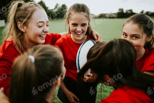 Preview: Cheerful young rugby players on the field