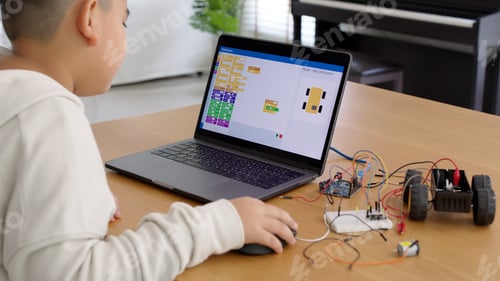 Preview: Young asia student remotely learn online at home in coding robot car