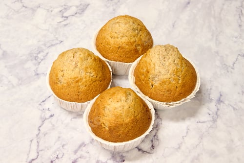 Preview: homemade spelled muffins on white marble