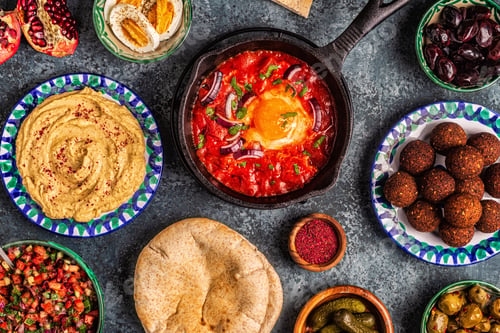 Preview: Falafel, hummus, shakshuka, Israeli salad - traditional dishes of Israeli cuisine.