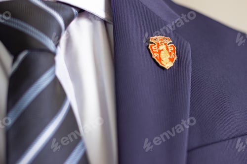 Preview: Business suit with South Grand Prairie High School lapel pin