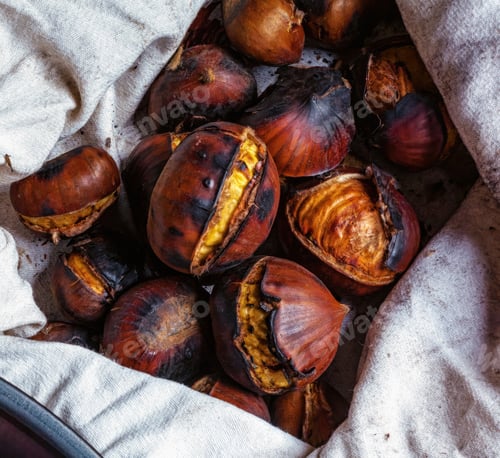 Preview: Roasted chestnuts resting in a cloth after cooking