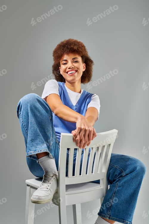 Preview: Woman gracefully perched on ivory throne