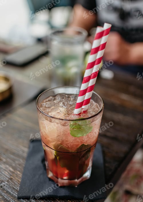 Preview: Cocktail with ice, mint, and striped straws