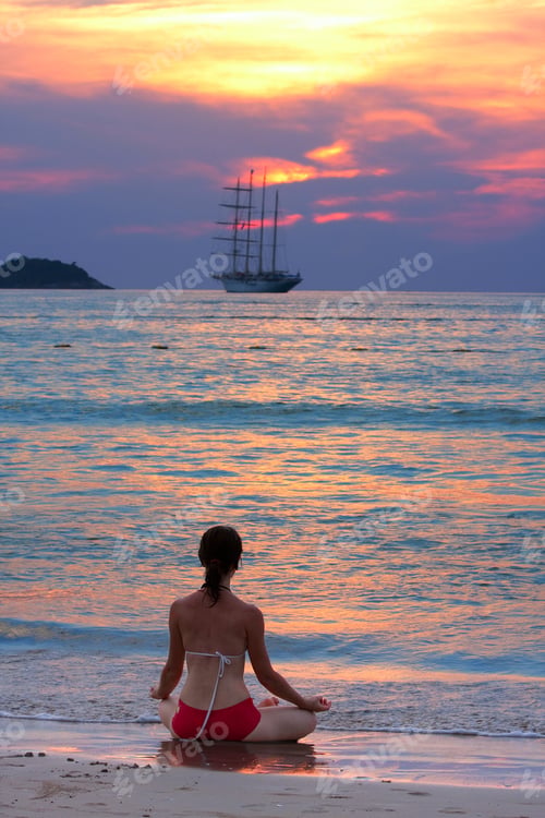 Preview: Woman Meditating At The Beach
