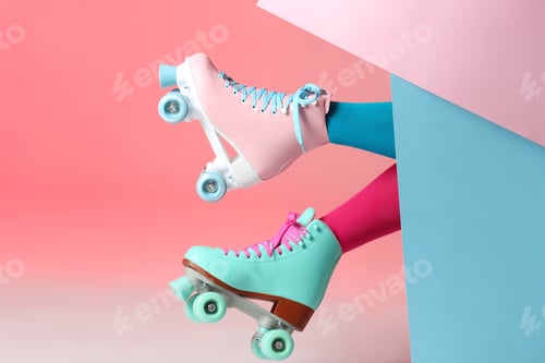 Preview: Woman with vintage roller skates on color background, closeup