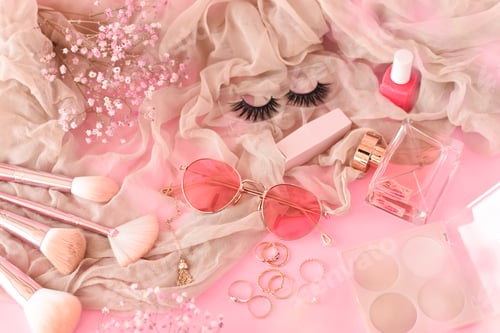 Preview: Pink beauty and fashion accessories items on pink background
