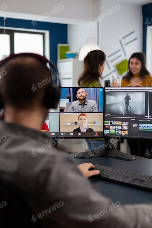 Preview: Videographer employee having video conference wearing headset