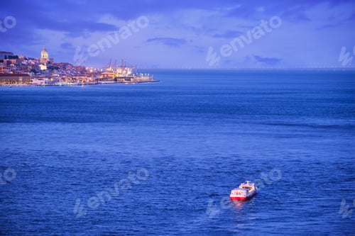 Preview: View of Lisbon view over Tagus river with yachts and boats on sunset. Lisbon, Portugal