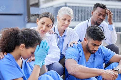Preview: Shot of a group of doctors looking sad against a city background