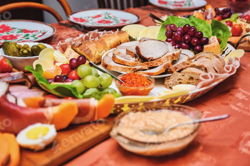 Preview: Close-up image of dinner table full of various food.