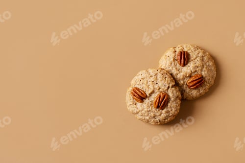 Preview: Pecan cookies close up on brown background