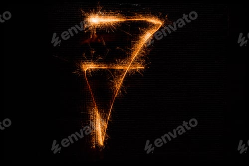 Preview: The Number 7 Made Of Sparklers On Black Background