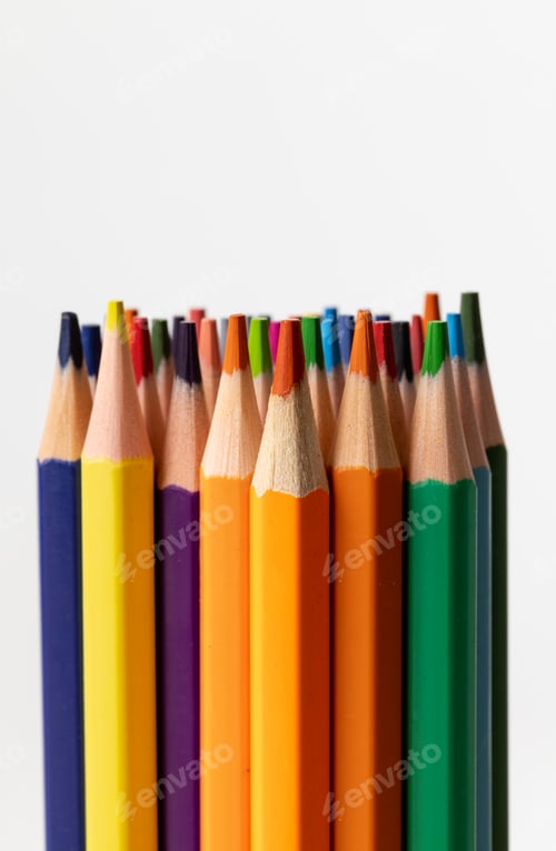 Preview: Vertical image of colorful crayons on white surface