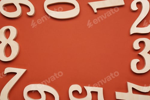Preview: Frame made of wooden numbers on brown background, flat lay. Space for text