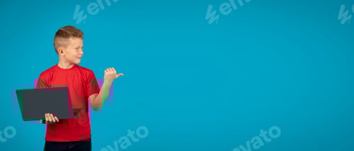 Preview: Check This. Smiling Boy Holding Laptop And Pointing Aside At Copy Space