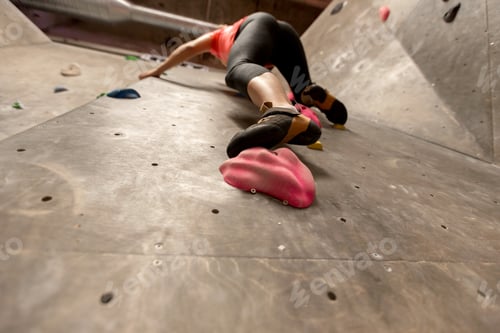 Preview: foot of woman exercising at indoor climbing gym