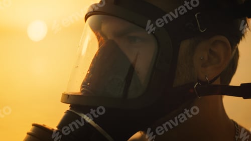 Preview: Man with gas mask at sunsset