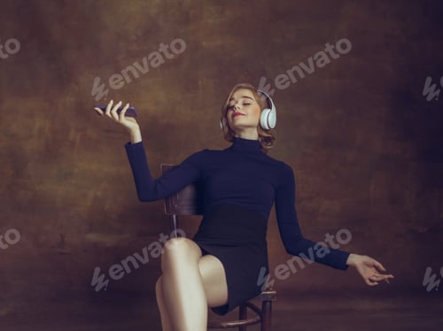 Preview: Young woman in art action isolated on brown background. Retro style, comparison of eras concept