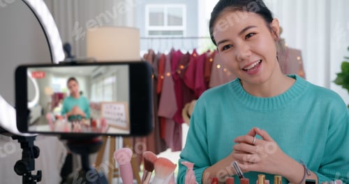 Preview: Asia woman micro influencer record live viral video camera at home studio.