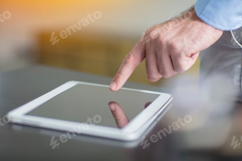 Preview: Man using tablet in office, close-up