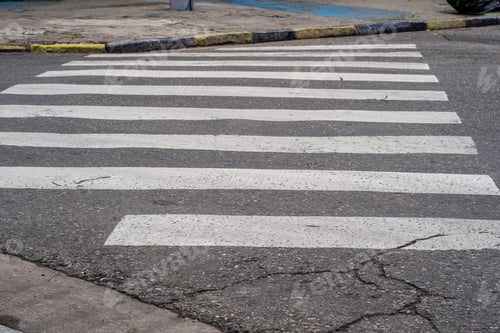Preview: Zebra crossing for pedestrians on a damaged street for safe driving