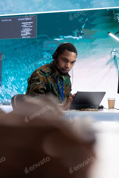 Preview: Military crew in a high tech control center working with real time data