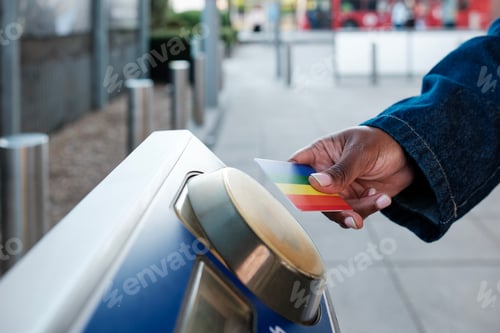 Preview: Woman using contactless payment entering subway station