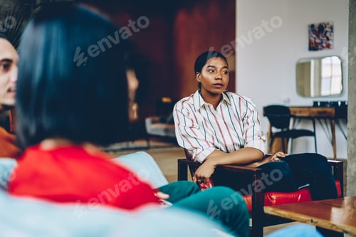 Preview: Interested black woman listening to friends