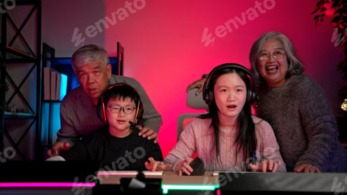 Preview: Happy grandparents playing games with grandchildren in in a neon lit room