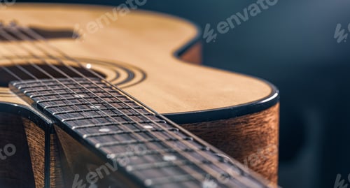 Preview: Close-up of a classical acoustic guitar in beautiful lighting.