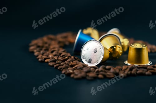Preview: close up on black-blue background lie roasted coffee beans laid out in the shape of a heart in the