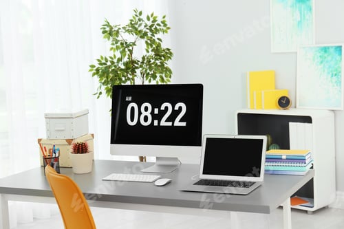 Preview: Stylish workplace with laptop and desktop computer on table