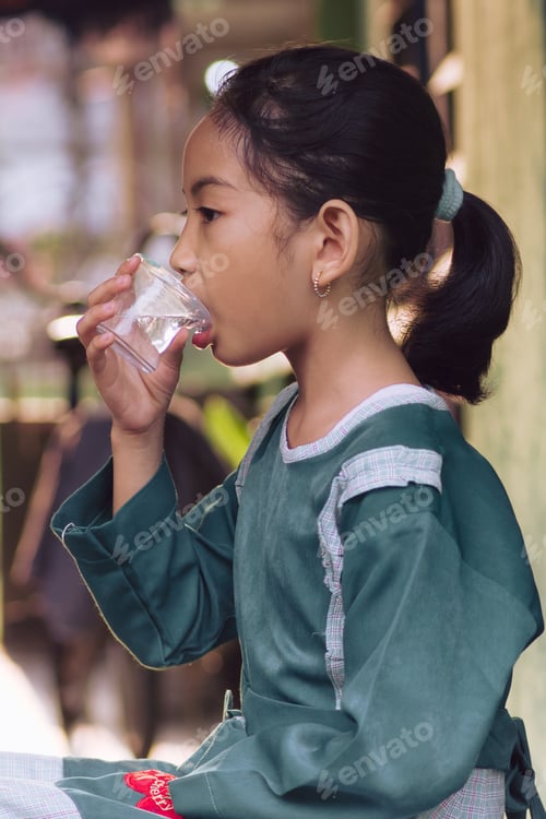 Preview: little girl drinking mineral water